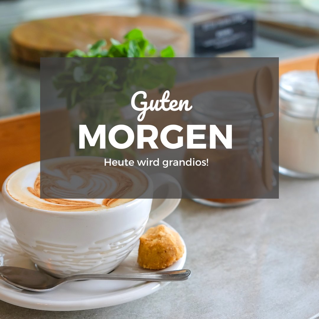 Einen Schönen Guten Morgen Bilder mit einer kunstvoll servierten Tasse Kaffee, einem Keks und einem Text, der einen großartigen Tag verspricht, auf einem Café-Tisch.